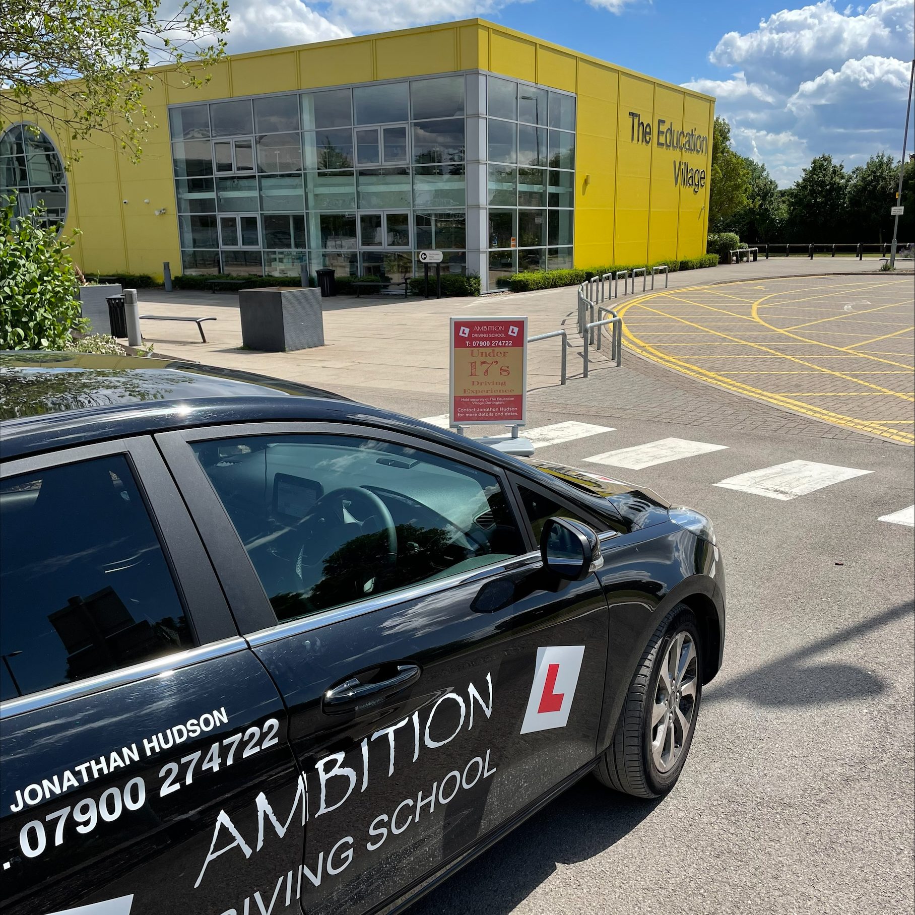 Ambition Driving school learner car parked outside the education village